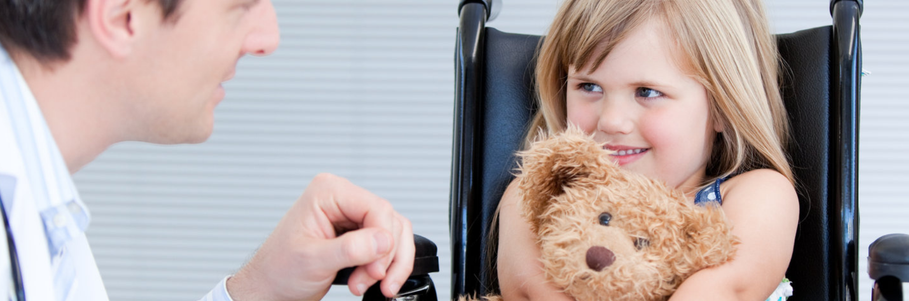 doctor with child in wheelchair